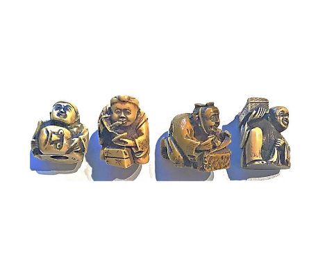 A group of 4 large size 20th century division 4 Netsuke.These are classified in the NBS in division 4. The Asian people didn'