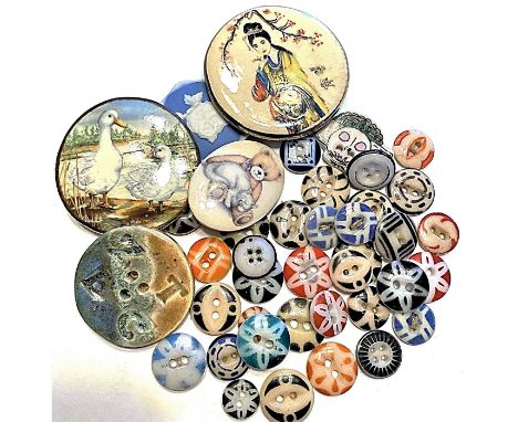 A good bag of assorted ceramics plus many china stencil buttons.This colorful lot includes several stencil patterns and color