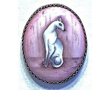 1 Large oval 20th century Russian enamel button.This hand painted white cat on a pink ground is set in a filigree silver sett