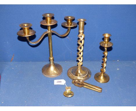 A quantity of Brass items to include candelabra, two twist stem candlesticks, Art Deco nutcrackers and a three wise monkeys t
