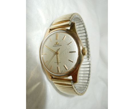 A yellow metal, believed to be gold cased Jaeger le Coultre Automatic gentleman's wristwatch having a pale champagne coloured