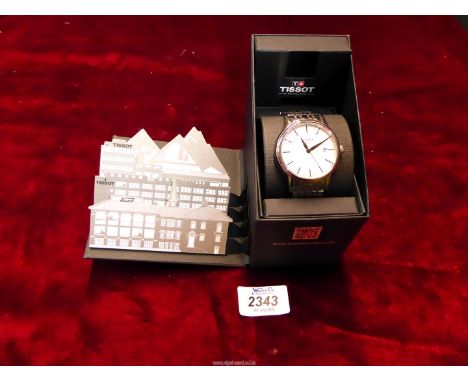 A gentleman's Tissot Carson model watch, stainless steel with sapphire crystal, as new, with box and warranty paperwork.