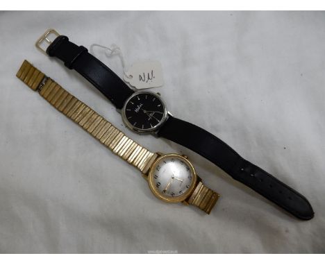A Timex waterproof crown-wound gentleman's wristwatch having a silver coloured face with Arabic numerals, - (expanding bracel