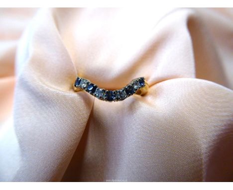 An 18ct gold ring with curve, set alternating five blue stones and four diamonds,size M, overall weight 3.71 gm.
