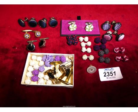 A quantity of cufflinks and studs including T.M. Lewin, pair of black and 925 silver cufflinks, fabric knots, and fabric and 