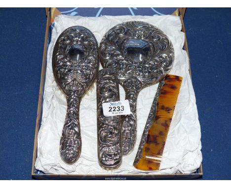 A Silver dressing table set comprising hairbrush, comb, clothes brush and mirror, Birmingham 1970, maker B &amp; Co. (Broadwa