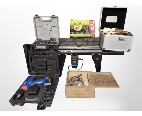 A Power Craft table saw, boxed Ryobi jigsaw and four boxes of power tools and hardware 