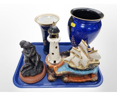 A Carlton Ware lustre trumpet vase, a further Carlton Ware vase on blue ground, a resin figure of two lovers, and a French ce