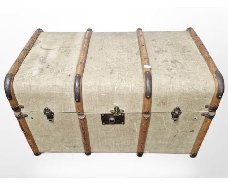 An early 20th century canvas & wooden bound trunk, width 76 cm 