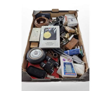 A quantity of wristwatches, trinkets, binoculars, calculators, vintage mobile phones, lighters, etc. (1 box)