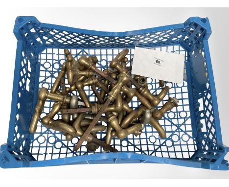 A crate of vintage brass door handles.