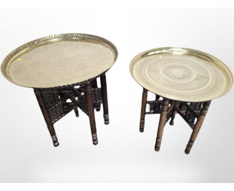 Two Islamic bobbin turned occasional tables with engraved brass tops, largest 62 cm diameter 
