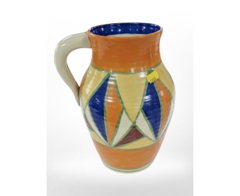 A reproduction Clarice Cliff style jug, bearing marks, height 29cm.