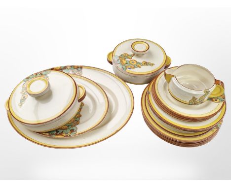 21 pieces of Clarice Cliff for Wilkinson Ltd Bizarre dinner wares in the Sunshine pattern.