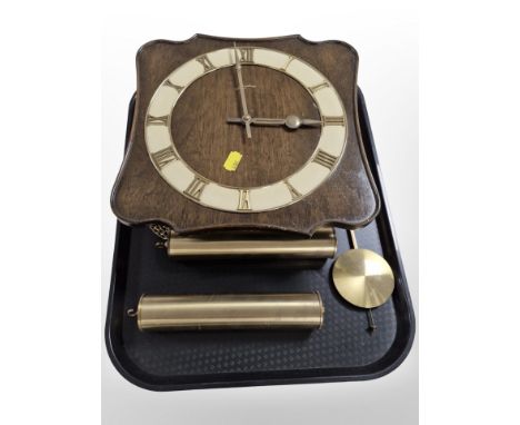 A Junghans wall clock with brass weights and pendulum.