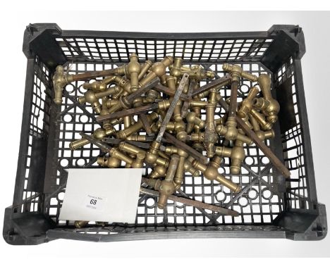 A crate of vintage brass door handles.