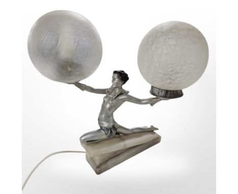 An Art Deco alabaster, silvered and patinated metal figural table lamp, with globular frosted glass shades, height 39cm. COND