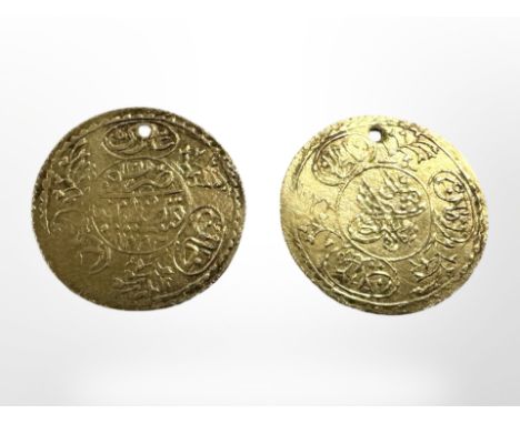 Two Middle-Eastern gold coins, diameter 2cm.  CONDITION REPORT: 2.4g