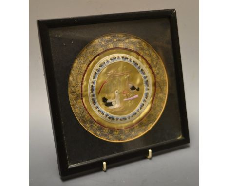 A Chinese circular silk panel, the central panel embroidered with a pair of birds, framed