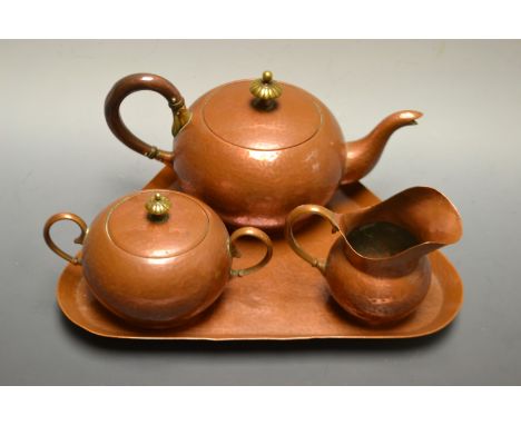 An Arts and Craft  copper tea service, comprising a bullet shaped teapot, milk jug, sugar bowl and cover, and rounded triangu
