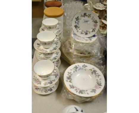 A Royal Worcester June Garland dinner service comprising dinner plates, side plates, bowls, cups ans saucers etc 