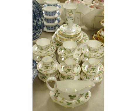 A Wedgwood Wild Strawberry pattern dinner and tea service for six, including, dinner and side plates, cups and saucers, gravy