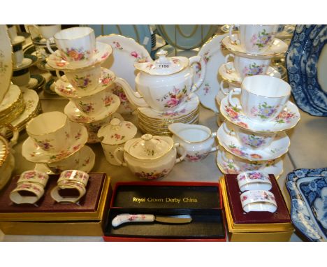 A Royal Crown Derby Posie pattern tea set comprising teapot, sucrier and cover, milk jug, thirteen cups and saucers, twelve t