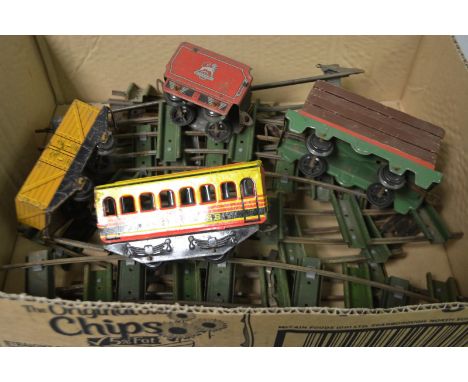 Trains O Gauge - a Brimtoys First Class passenger coach;  a Tri-ang Hornby wooden plank wagon,  another goods wagon, No 67, s