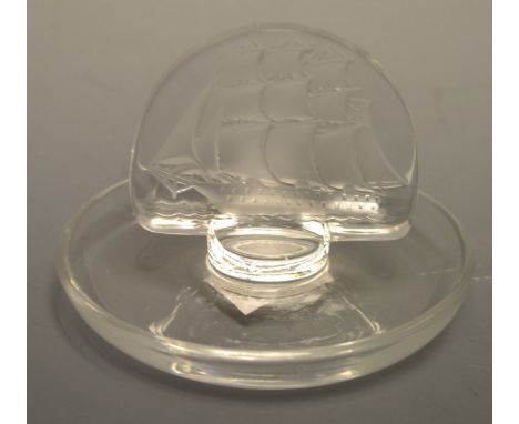 A Lalique glass ashtray, with semi circular frosted glass panel engrqved with a three masted ship, 9cm diam, inscribed mark
