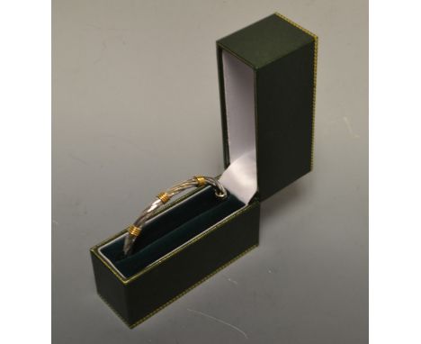A 9ct white gold rope twist hinged bangle, 7.5g, boxed