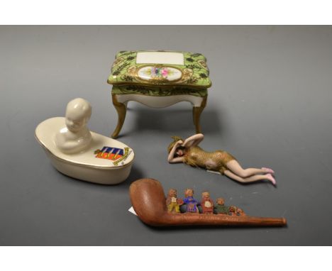 An Art Deco porcelain model naked bathing girl;  a Florentine chain crestedware model bathing baby, Gr Yarmouth crest;  a pip