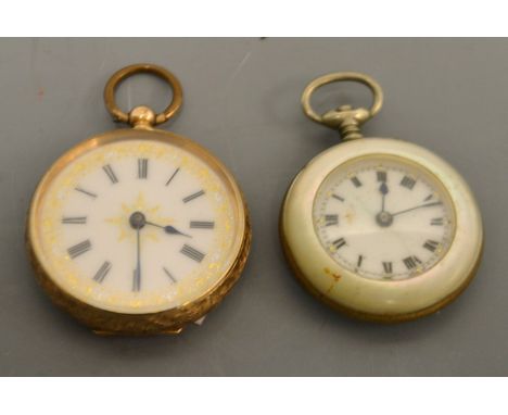A lady's 14ct gold cased fob watch, jeweled white enamel dial, Roman numerals, key wing movement, 30mm diam, 28g gross;  a mo