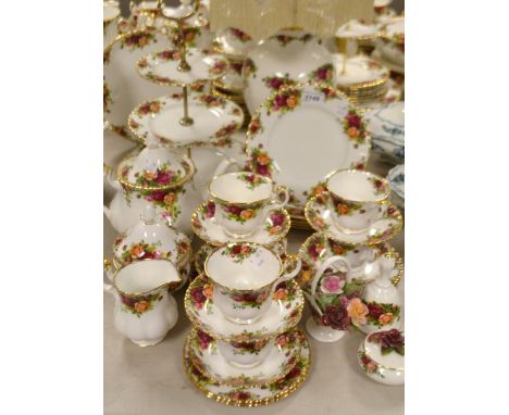 A Royal Albert Old Country Roses tea service for six, comprising a three tier cake plate, side plates, cake plates, teapot, t