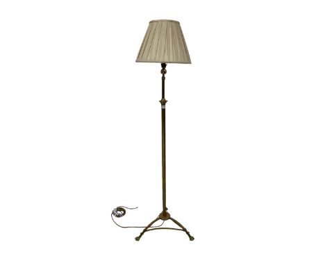 Late 19th century brass standard lamp, central cylindrical column with tripod base terminating in hairy paw feetDimensions: H