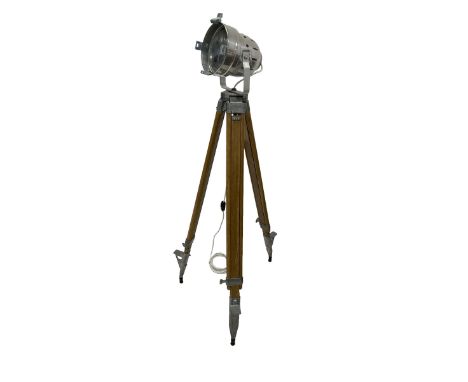 20th century polished metal lamp on theodolite tripod standDimensions: Height:&nbsp;135cm&nbsp;