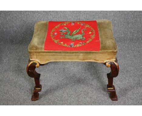 A Georgian walnut and gilt footstool with tapestry upholstered seat on cabriole supports. H.50 W.63 D.42cm. 