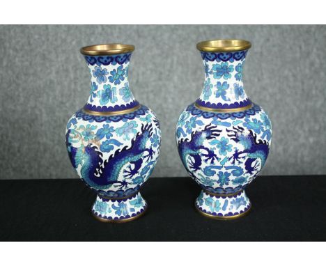 A pair of Japanese blue and white cloisonné enamel vases with dragon and floral motifs.  H.21cm. (each) 