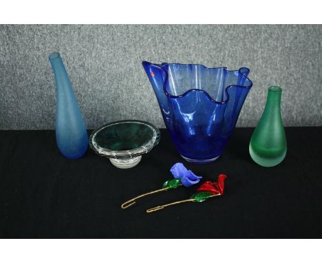 A collection of art glass, including two Mural glass petal flowers on silk stems, two bottle vases, a handkerchief vase and a