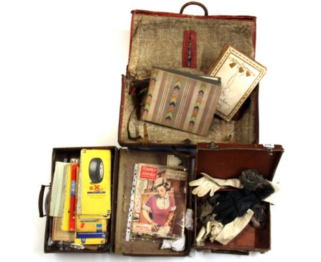 Three vintage leather travel bags and contents.
