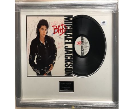 A framed signed album 'Bad'  by the American singer Michael Jackson and his Band, complete with certificate of authenticity, 