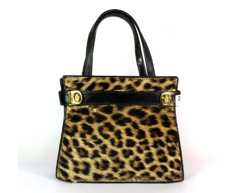 A 1930's leopard skin and leather handbag by Mac-Kays of Nairobi.