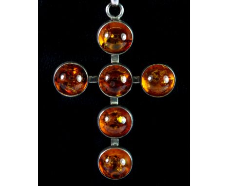 A white metal (tested silver) mounted amber set cross on a 925 silver chain.