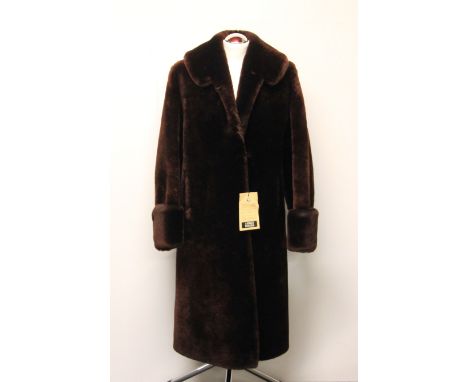 A vintage beaver lamb ladies coat with original label for Ashley Russell.