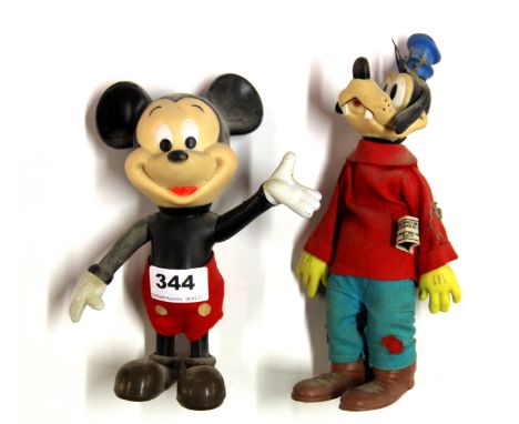 Two vintage Disney figures of Mickey Mouse and Pluto.