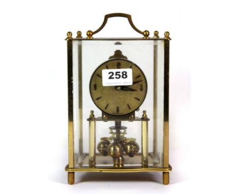 A Kundo four glass four hundred day mantle clock.