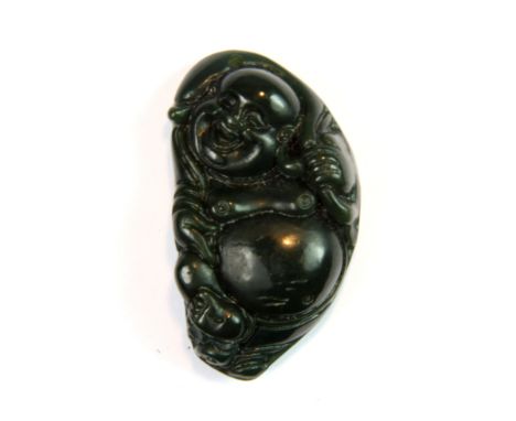 An early 20th century Chinese carved dark green nephrite jade pendant of the Happy Buddha, H. 4.8cm.