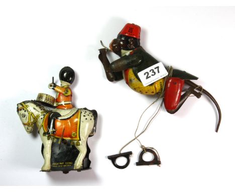 A vintage mechanical tin toy drum major H. 14cm and Lehmann tin toy climbing monkey, L. 20cm.