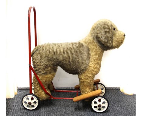 A vintage push along dog toy by Tri-ang and Pedigree.