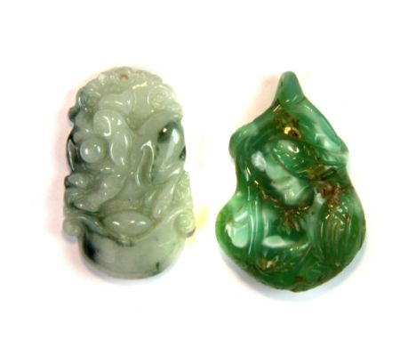 A Chinese carved jade gourd pendant and a carved jade pig amulet, H. 3.5cm.