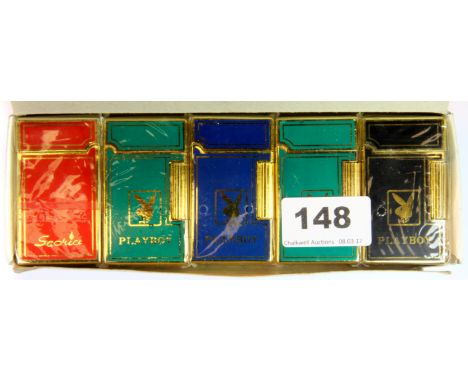 A box of ten unused vintage Playboy enamelled gold plated lighters.